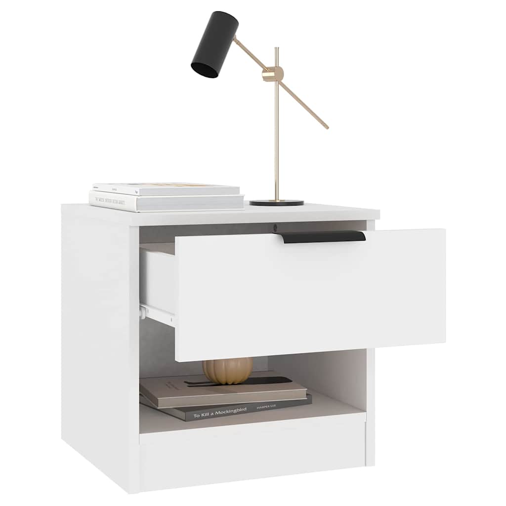 White bedside cabinet with drawer and shelf holding books and lamp