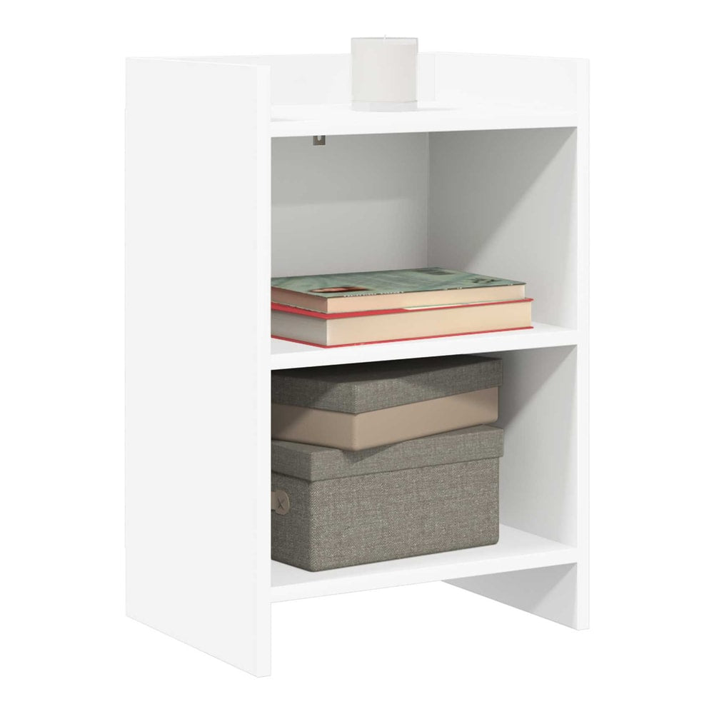 The bedside table has two shelves and a small top surface, holding books and a box