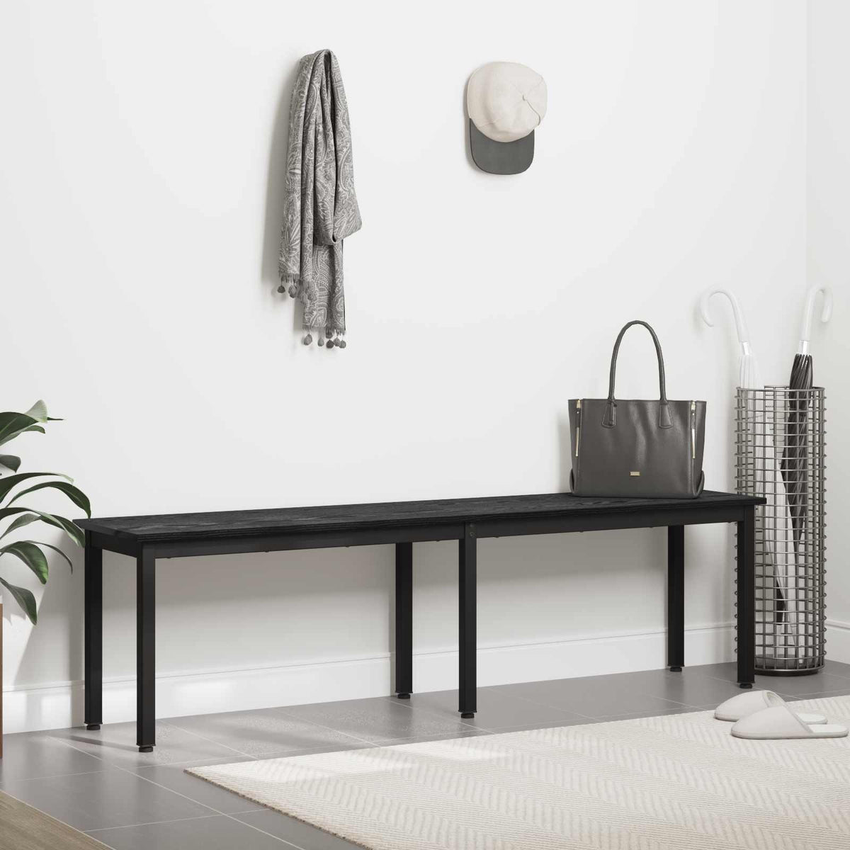 The black wooden bench positioned in a hallway with a bag and accessories nearby