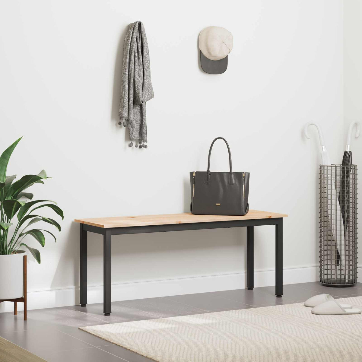 The pine wood bench in a hallway with coat rack and umbrella stand