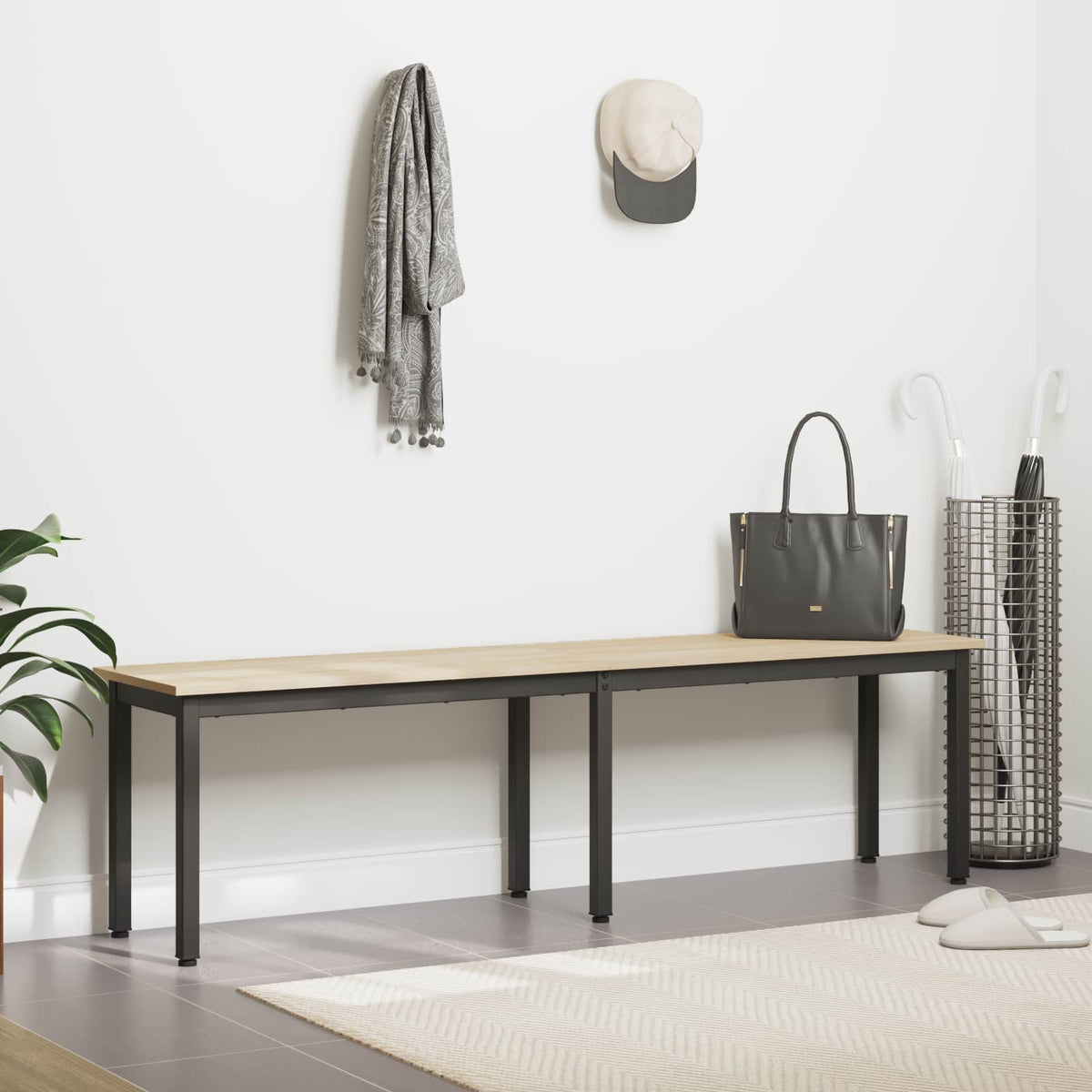 The wooden bench is shown in a hallway with coats and a bag nearby