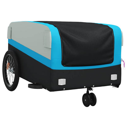 A close-up of the black and blue bicycle trailer showing its side and front wheels