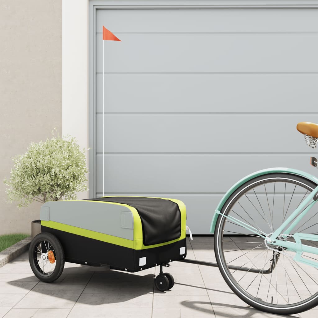 vidaXL Bike Trailer Black and Green 30 kg attached to a bicycle parked outside a garage