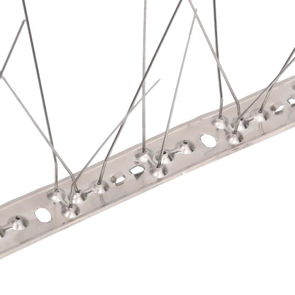 Close-up of the base of the bird spikes, showing the metal strip and prong attachments