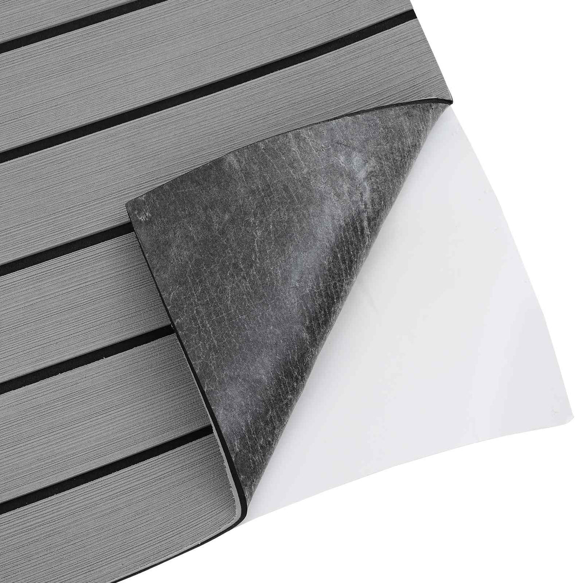 The back of the light grey and black striped boat mat, showing the adhesive backing being peeled