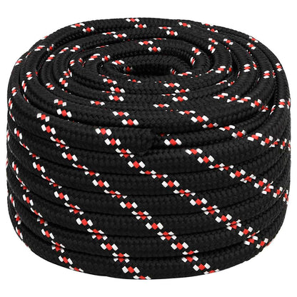 Black boat rope with red and white flecks coiled tightly