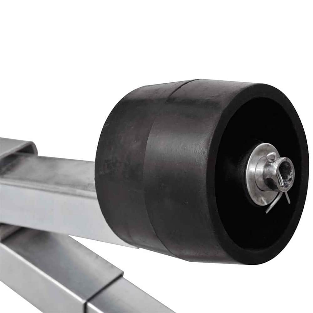 close up of a black keel roller on the boat trailer bottom support bracket