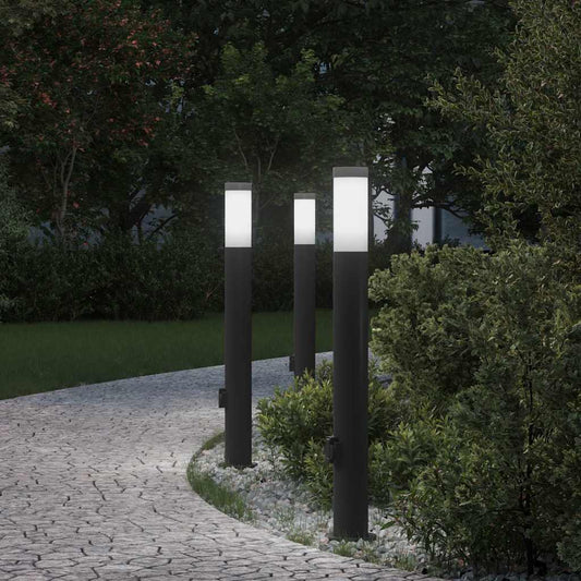 vidaXL Bollard Lights, three stainless steel outdoor lamps with white tops and black bases, set in a garden path