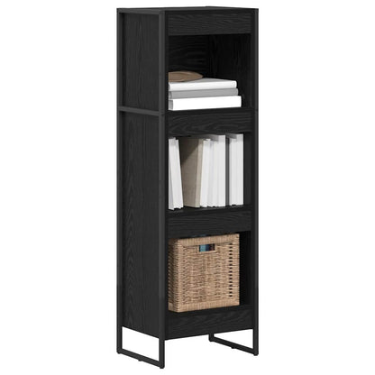 The standing shelf filled with books and a woven storage basket on the bottom shelf