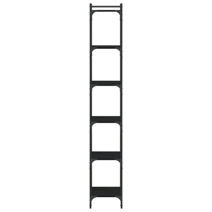 The narrow black bookcase seen from a low angle to highlight its vertical structure