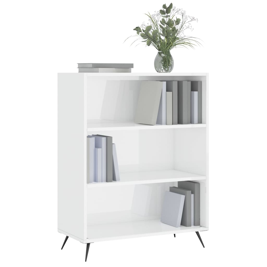 The white bookcase filled with books and a vase on the top shelf