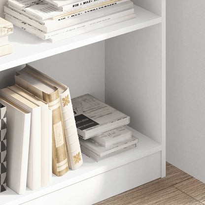 Close up of books on the shelves of the white bookcase