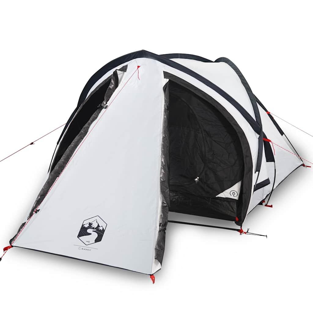 The white two-person camping tent with the door open, showing the black interior