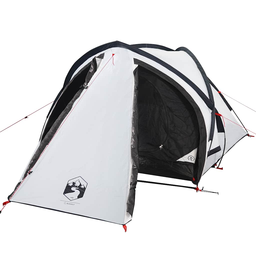 A rear view of the white two-person camping tent pitched outdoors