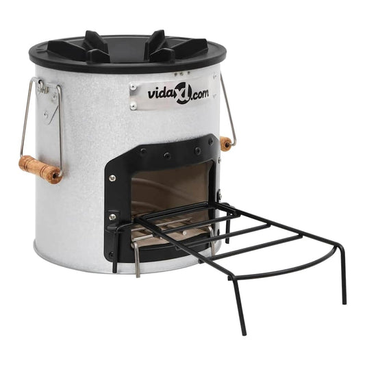 camping wood stove with front door open and cooking grate