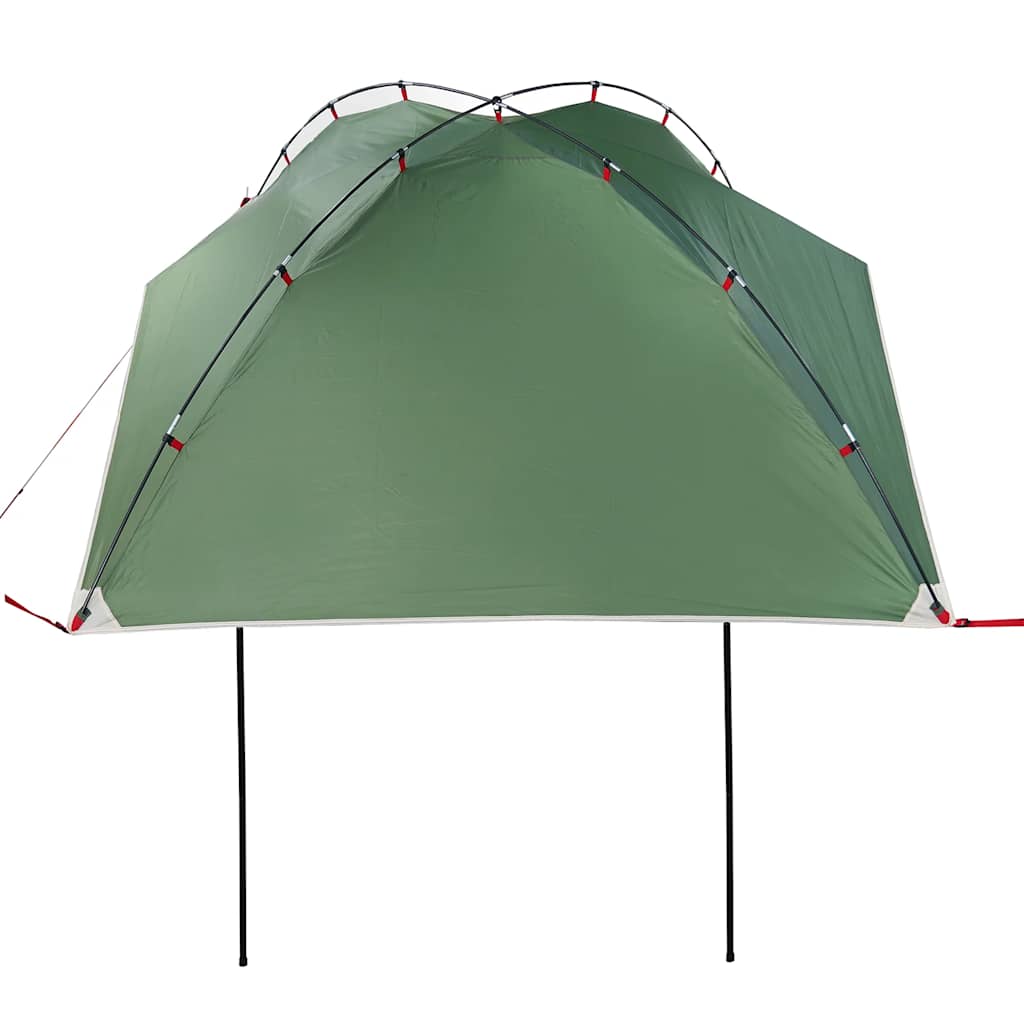 The green car tent viewed from the front, supported by poles