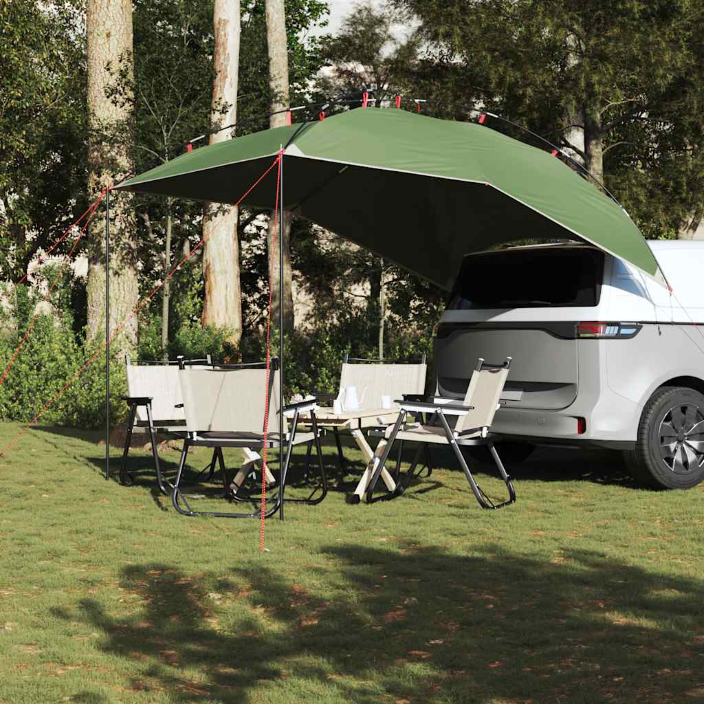 Green car tent providing shade over a picnic table and chairs next to a car
