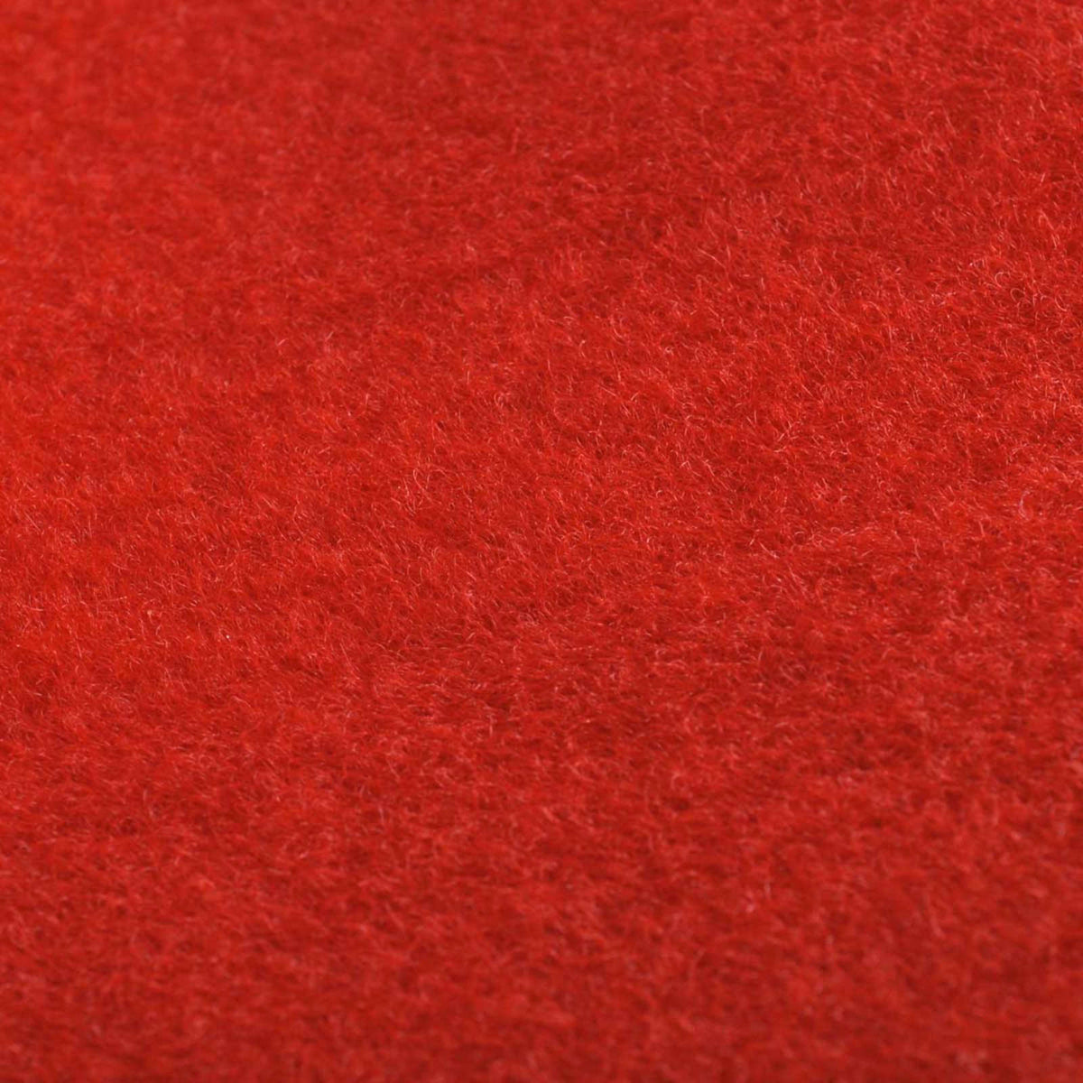 Extreme close-up of the fibres of the red polyester door mat