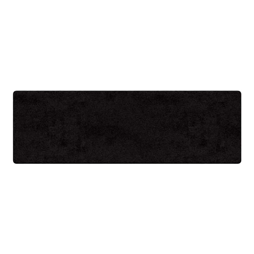 A black carpet runner with a textured surface