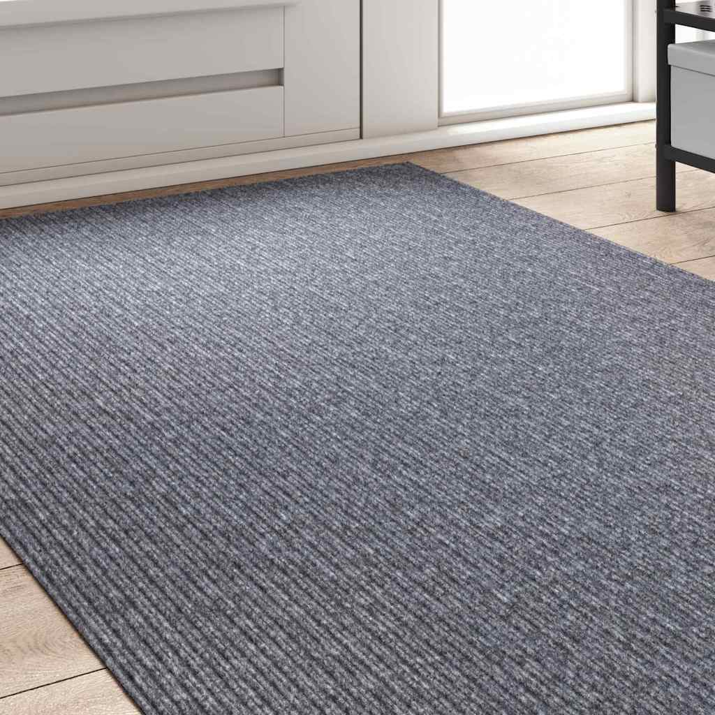 The carpet runner laid out on a light wooden floor near a white cabinet