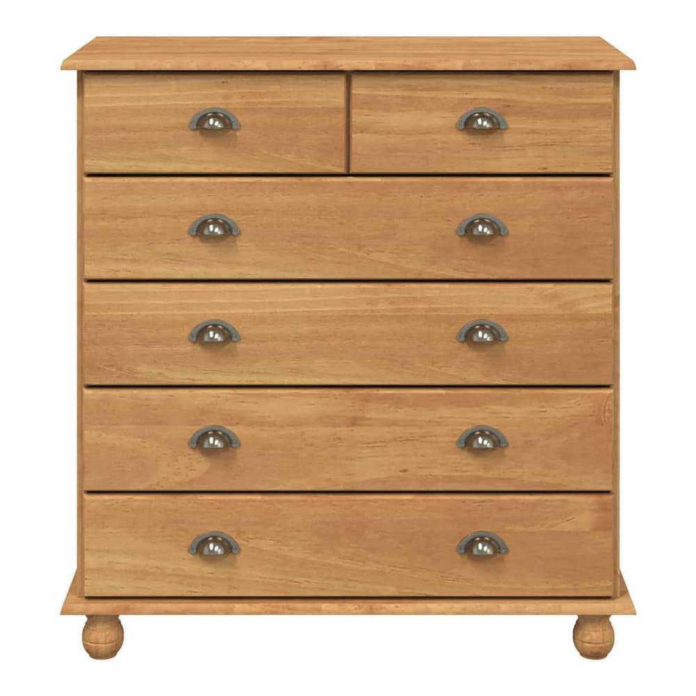 A close-up of the chest of drawers, highlighting the wood grain and the metal drawer handles