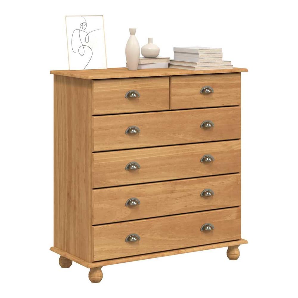 The brown solid pine wood chest of drawers with six drawers and round metal handles, displayed in a room setting