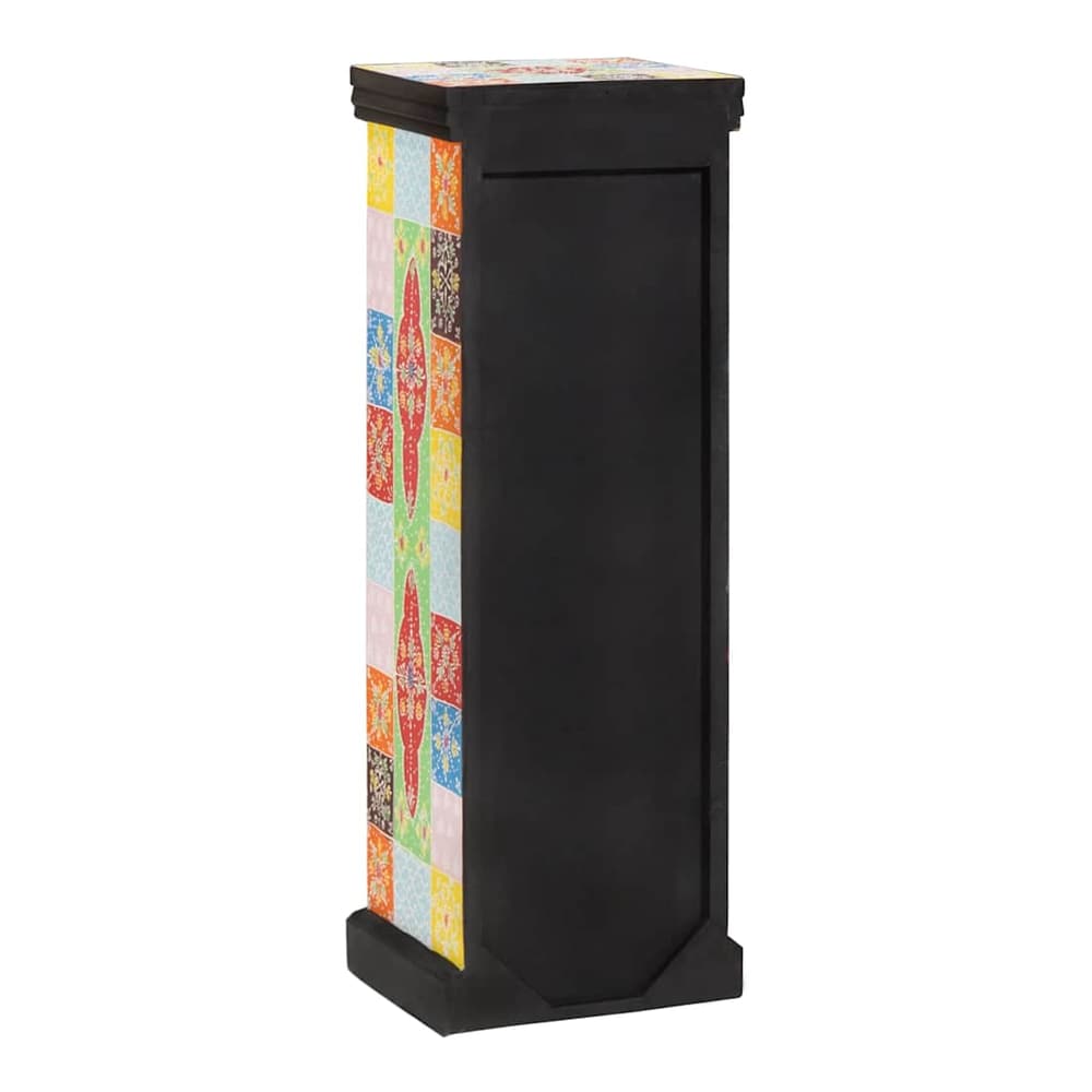 The chest of drawers showing the plain black back panel and the side pattern