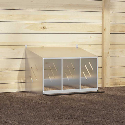 galvanised chicken nesting box with three compartments, shown against a wooden wall