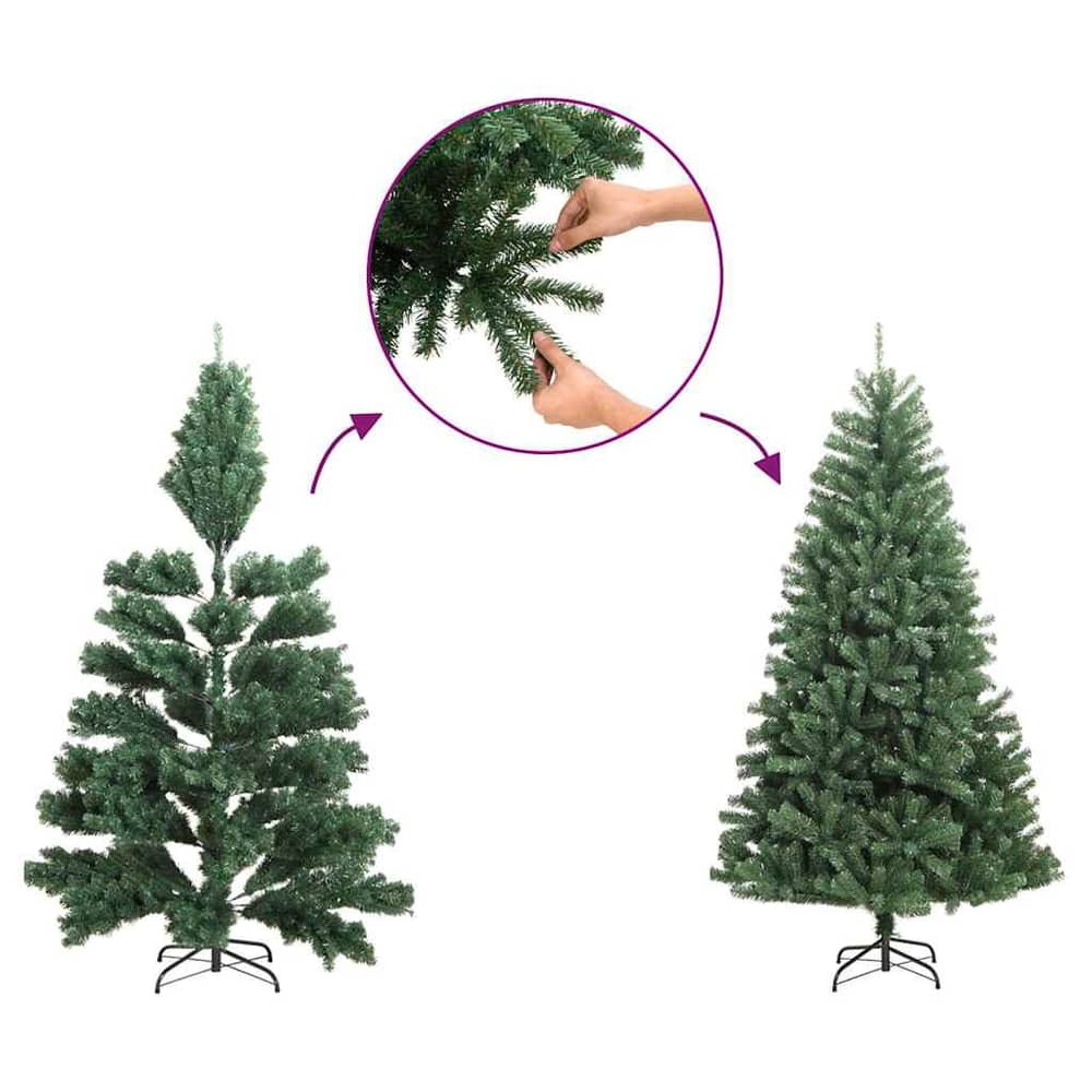 The artificial Christmas tree branches being fluffed out by hands to create a fuller shape