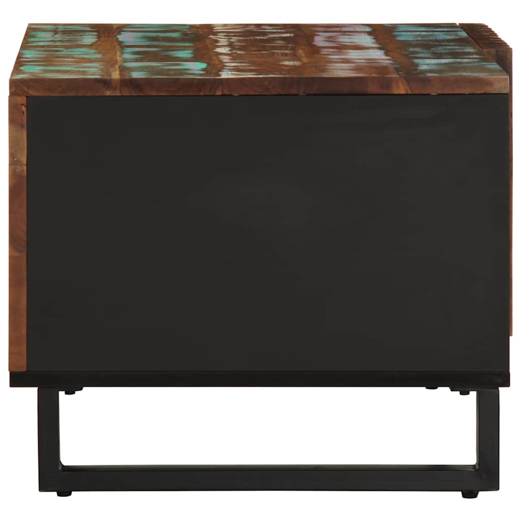 The coffee table has a black side panel and metal legs