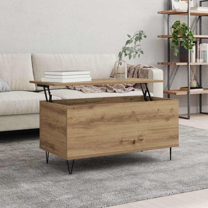 The coffee table with its top partially lifted, revealing storage space inside