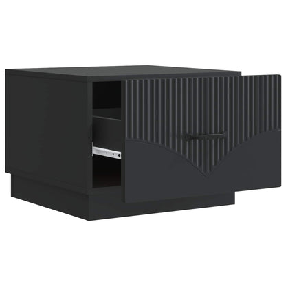 The black coffee table with its drawer pulled open to reveal storage space inside