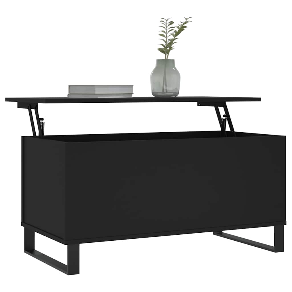 The coffee table with its top partially lifted showing a book and vase