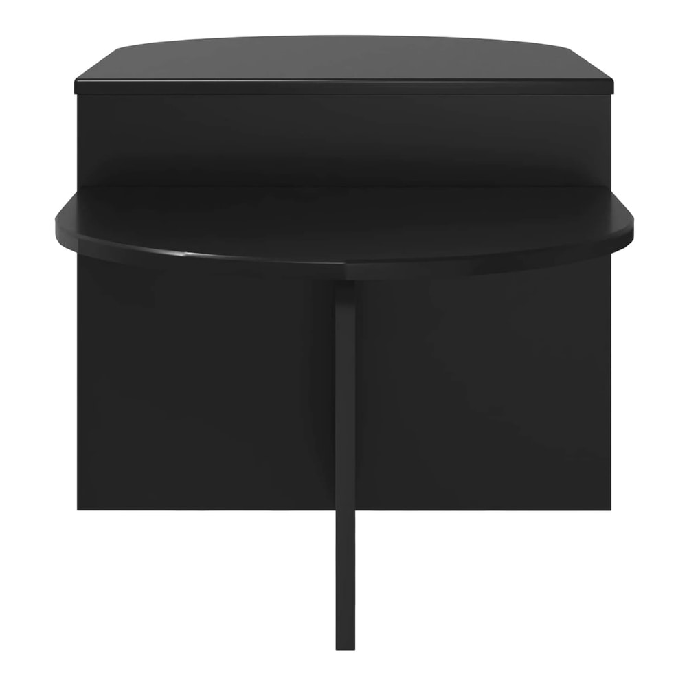The black coffee table viewed from the front showing its curved edge