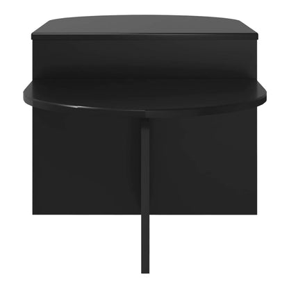 The black coffee table viewed from the front showing its curved edge
