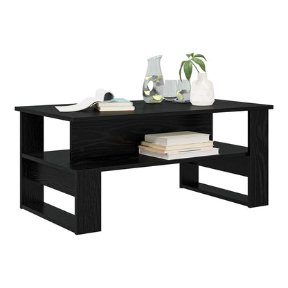 A black oak engineered wood coffee table with two shelves, styled with books and vases