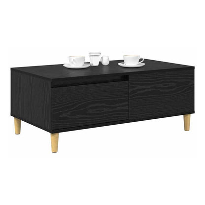 Black oak engineered wood coffee table with two cups and saucers on top