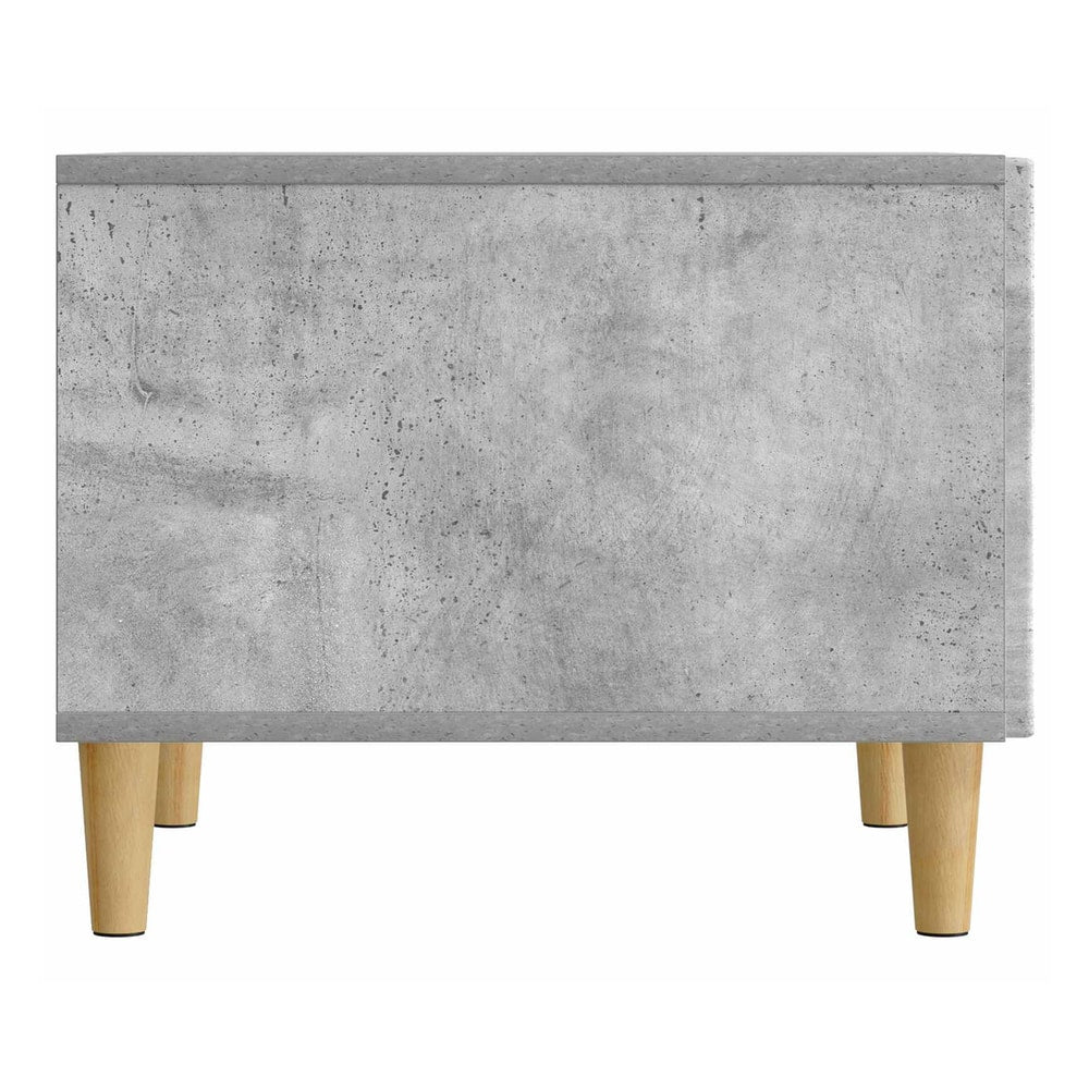 Back view of the concrete grey coffee table with its wooden legs