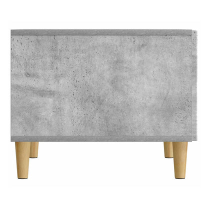 Back view of the concrete grey coffee table with its wooden legs