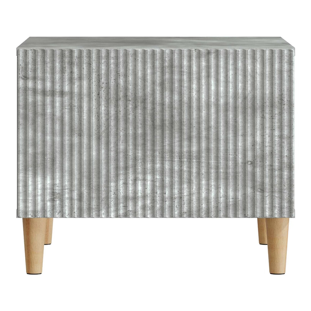 Close-up of the ribbed front panel of the concrete grey coffee table