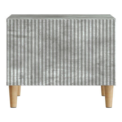 Close-up of the ribbed front panel of the concrete grey coffee table