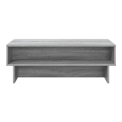 A grey Sonoma engineered wood coffee table with a shelf, viewed from the front