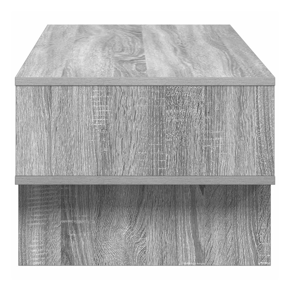 Side view of the grey Sonoma engineered wood coffee table showing its construction