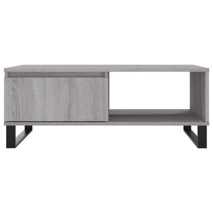 A grey coffee table with a drawer and open shelf, isolated on a white background