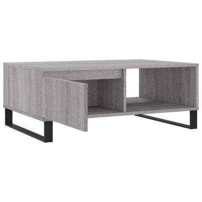 The coffee table with its drawer and compartment doors open, showing storage
