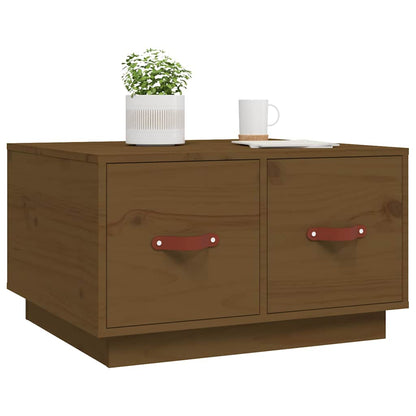 A honey brown solid wood pine coffee table with two drawers and red leather handles