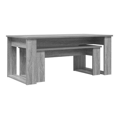 Two grey coffee tables, one nested inside the other, shown from the side