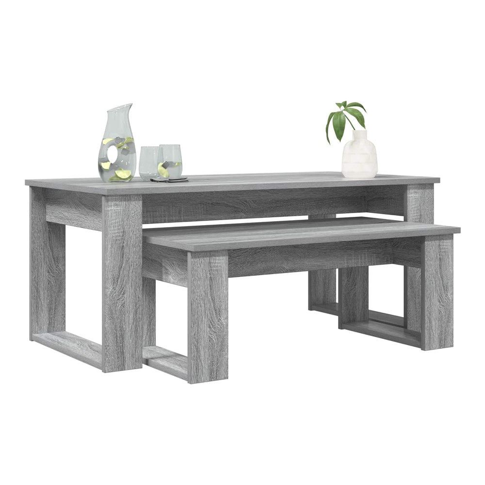 Grey coffee table set with a jug of water and glasses on the larger table