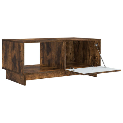 The coffee table with its cupboard door open showing storage space