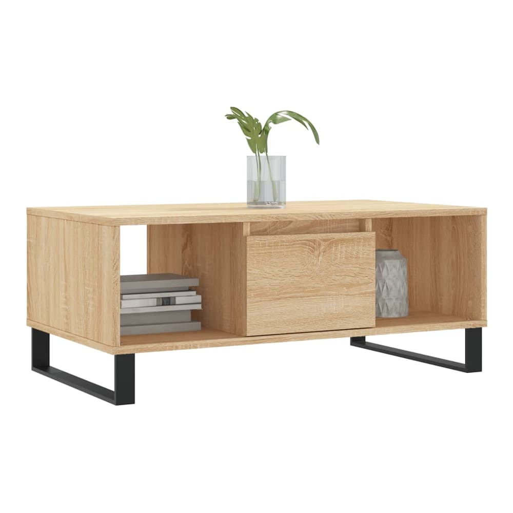 Coffee table with open shelf and drawer, decorated with books and vase